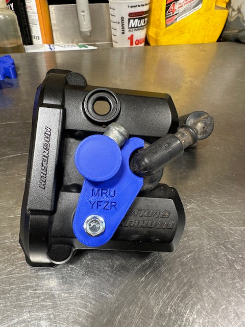 09-25 YFZR 450 spark plug hold down stock breather fitting