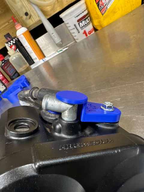 09-25 YFZR 450 spark plug hold down stock breather fitting