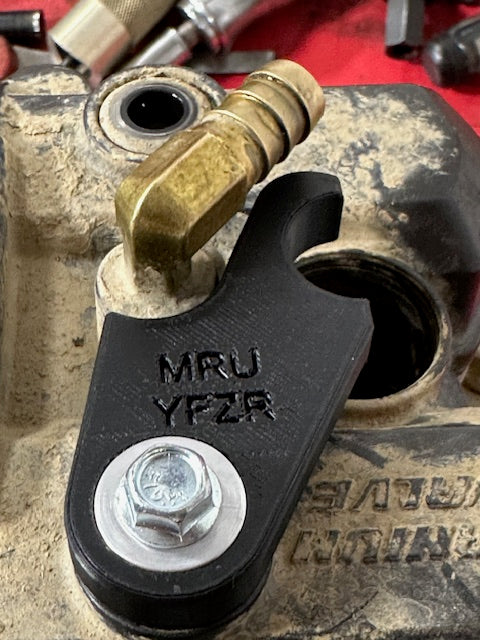 09-25 YFZR 450 Spark plug hold down